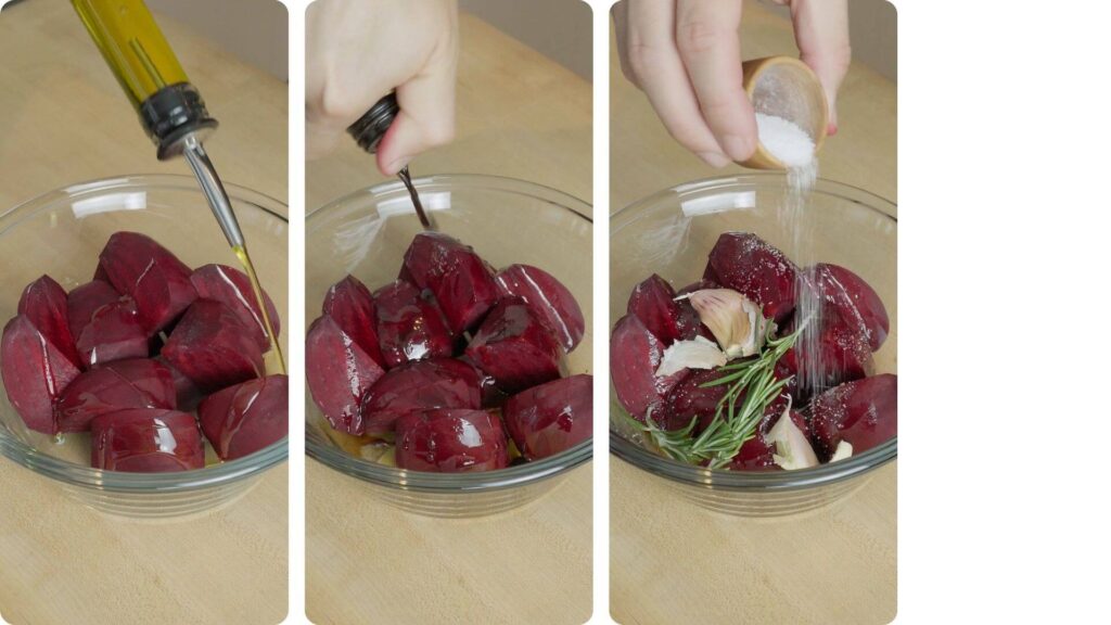 chopped beetroot in mixing bowl being seasoned with olive oil and salt