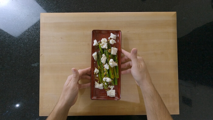 plate of asparagus salad with feta and toasted seeds