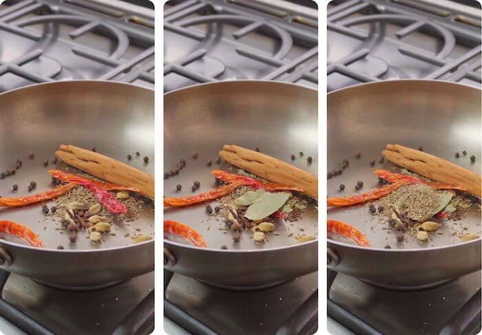 whole spices being toasted in frying pan