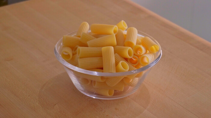 bowl of dried pasta, rigatoni