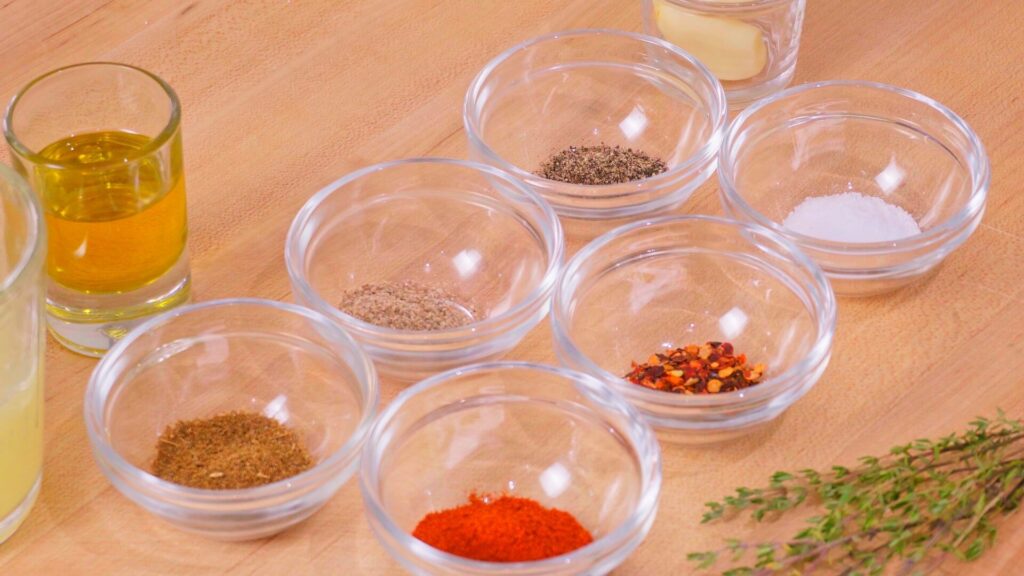 small dishes with herbs and spices ready for a marinade