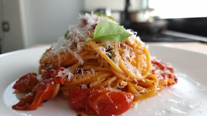 close up of the pasta sauce with basil and cheese 