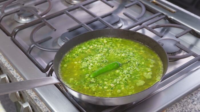 green rice in frying pan