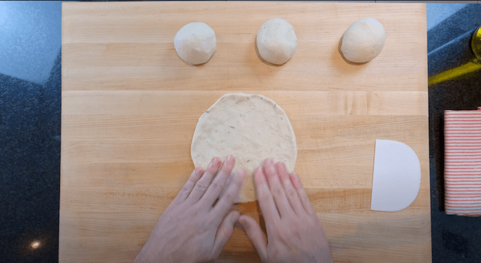 rolling pita bread dough