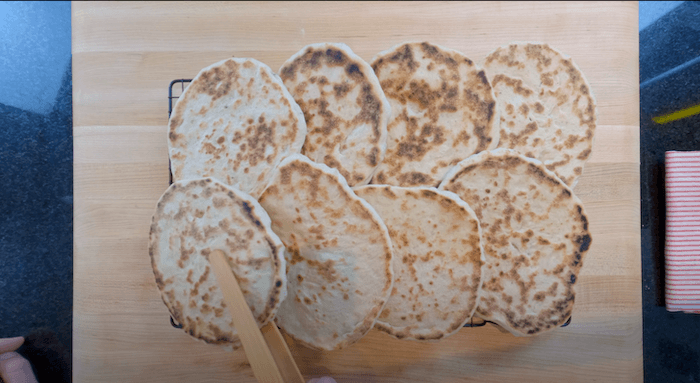 pita breads on a cooling rack