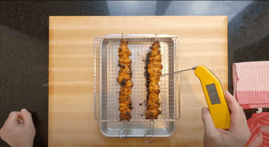 temperature thermometer checking the chicken,