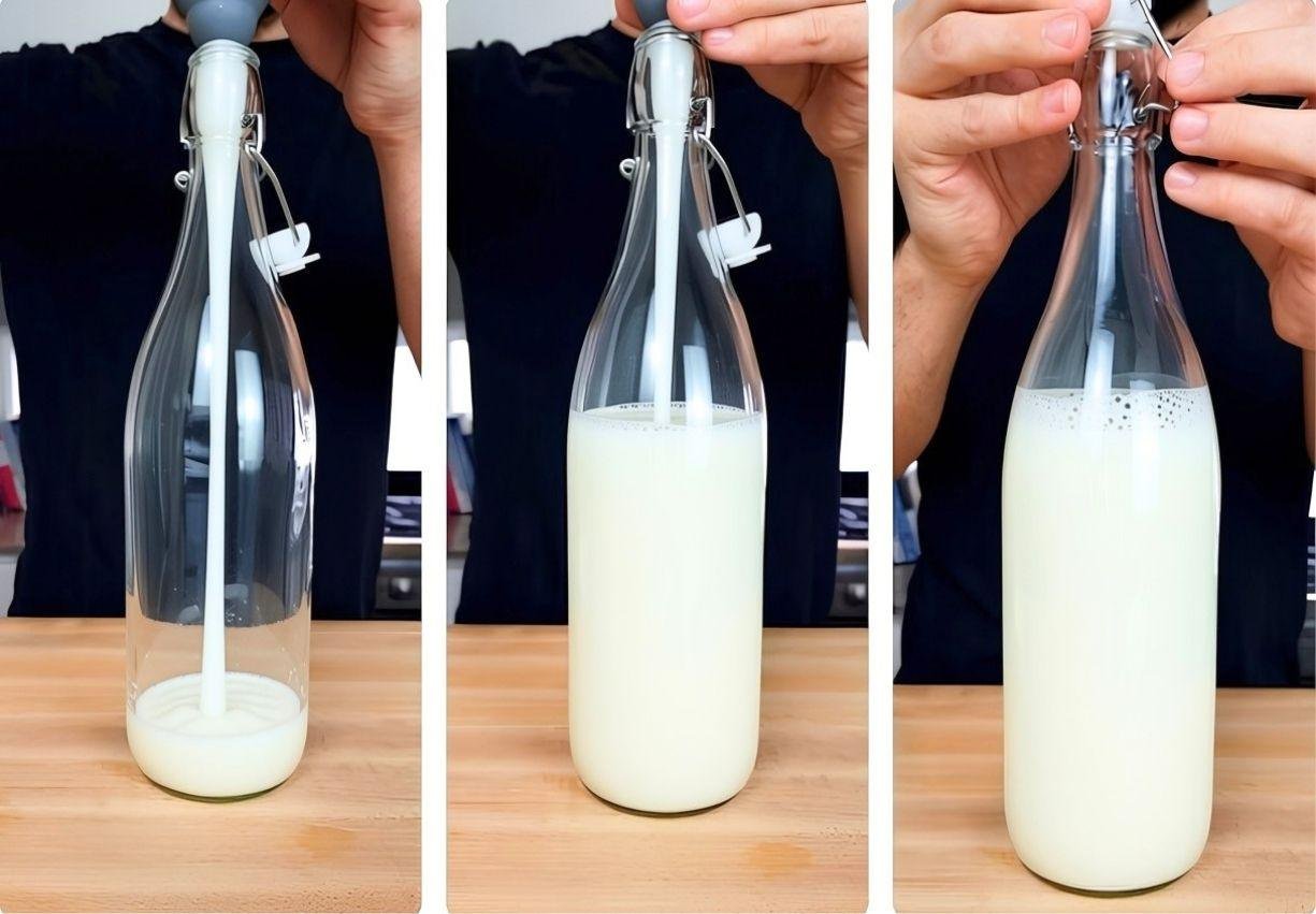 Homemade oat milk being poured into a bottle