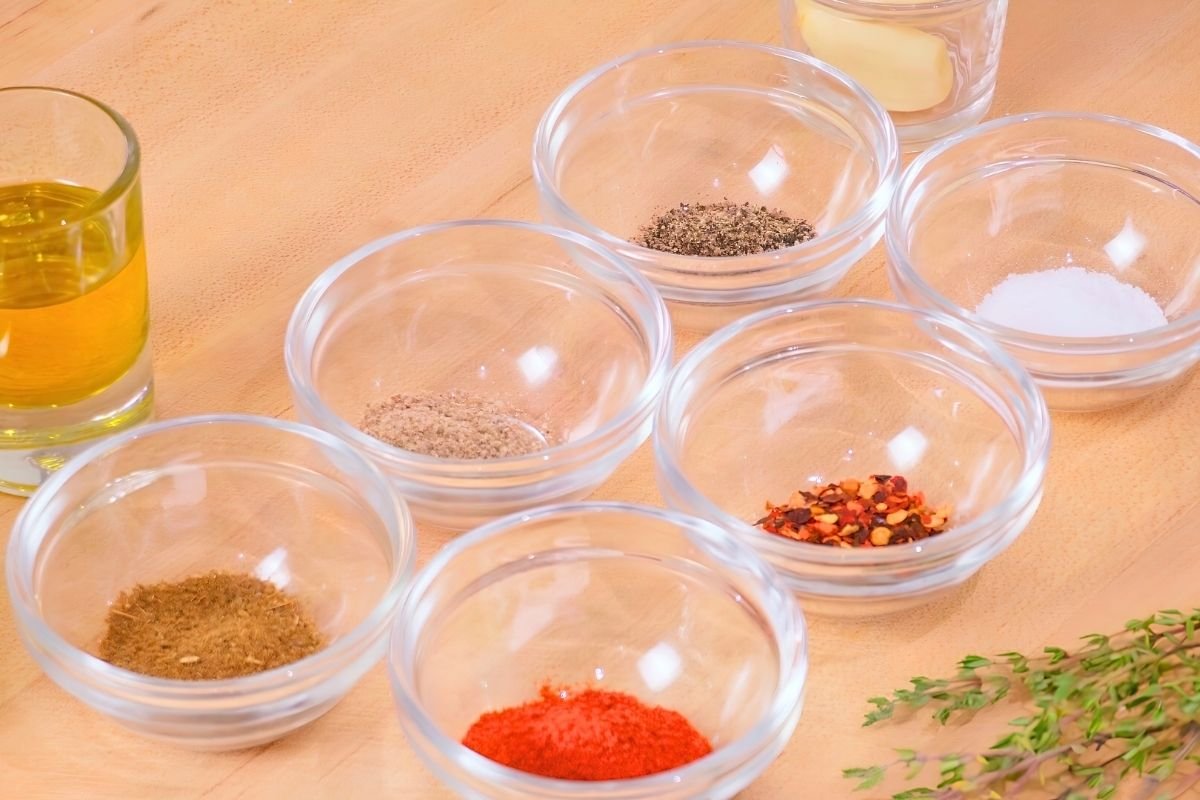 small dishes with herbs and spices ready for a marinade