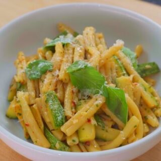 bowl of zucchini pasta with basil