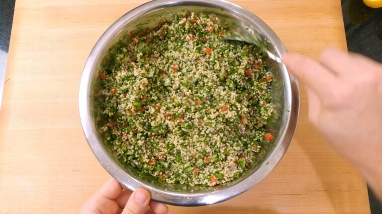 bowl of tabboleh with cous cous, herbs, vegeatbles