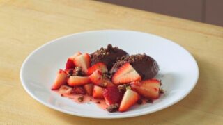 plate of dark chocolate mousse and strawberries