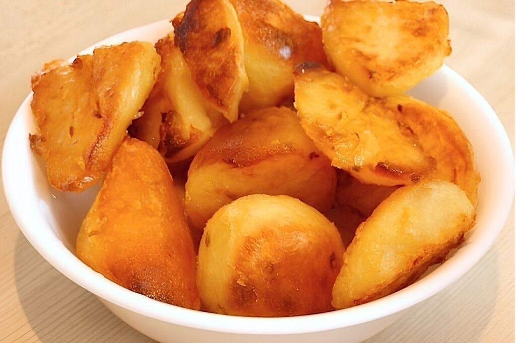 close up bowl of roast potatoes
