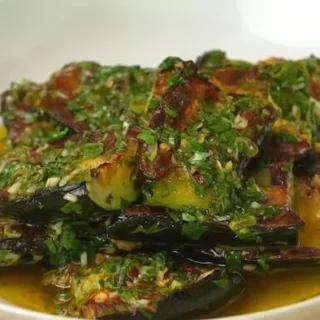 chimichurri courgettes marinading in a bowl
