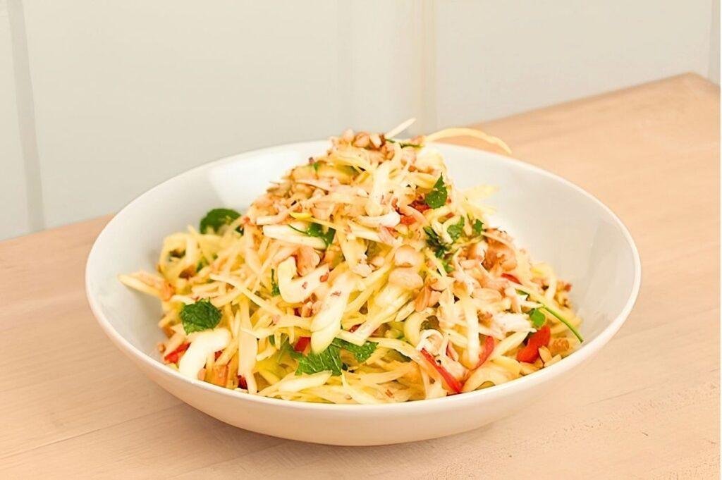A white bowl of colourful Vietnamese slaw.