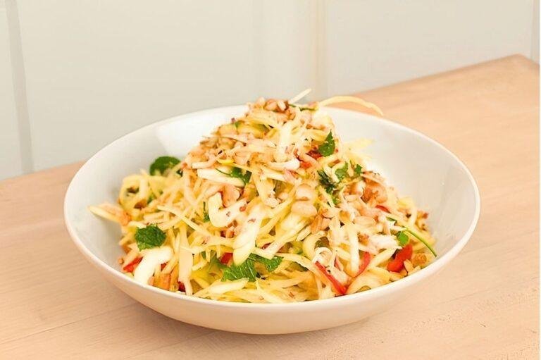 A white bowl of colourful Vietnamese slaw.