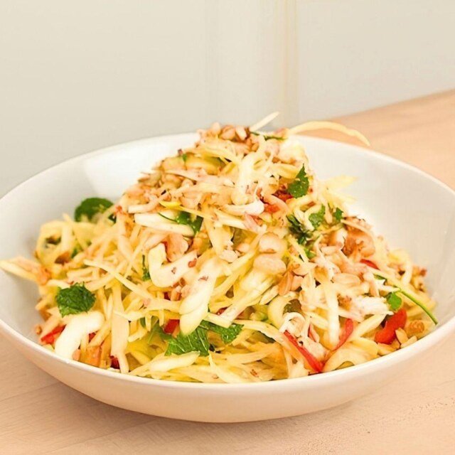 A white bowl of colourful Vietnamese slaw.