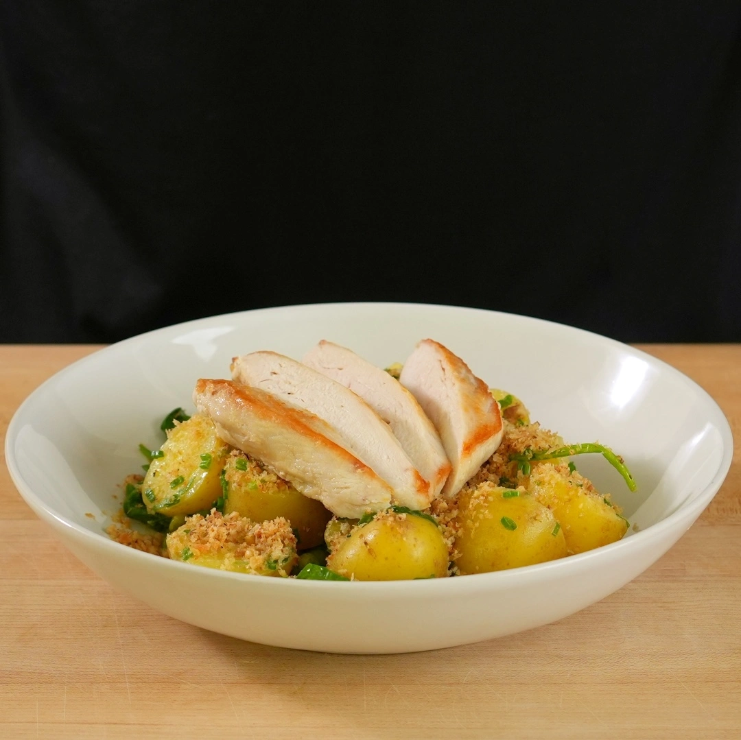 pan-seared-chicken-breast-on-top-of-new-potatoes.