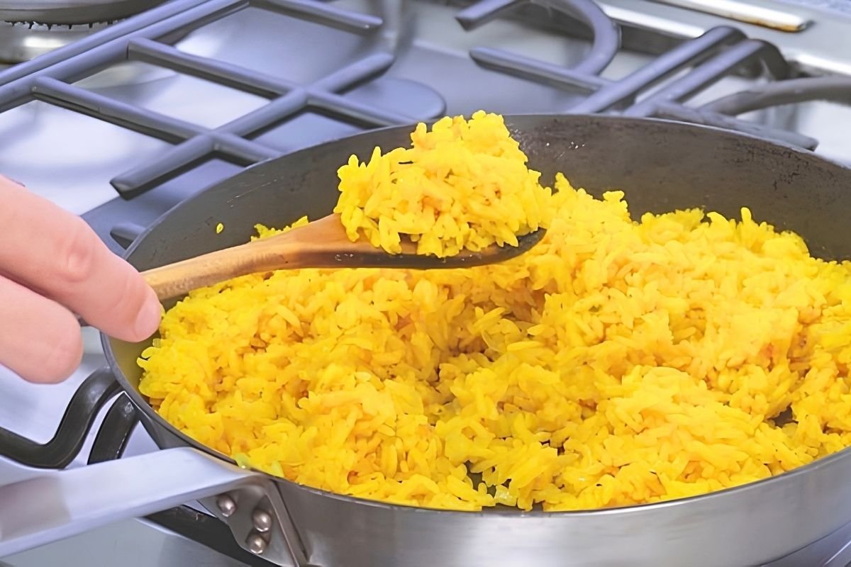 yellow rice in frying pan