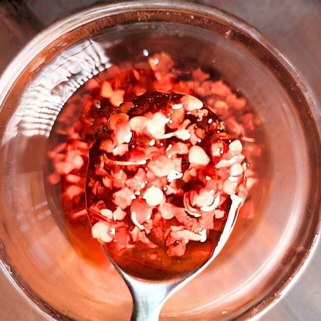 close up of chilli oil on a spoon
