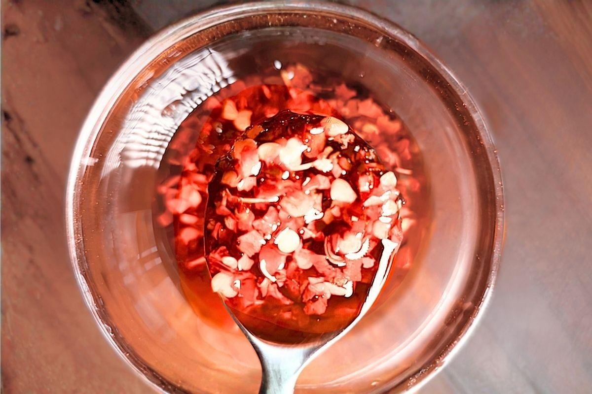 close up of chilli oil on a spoon