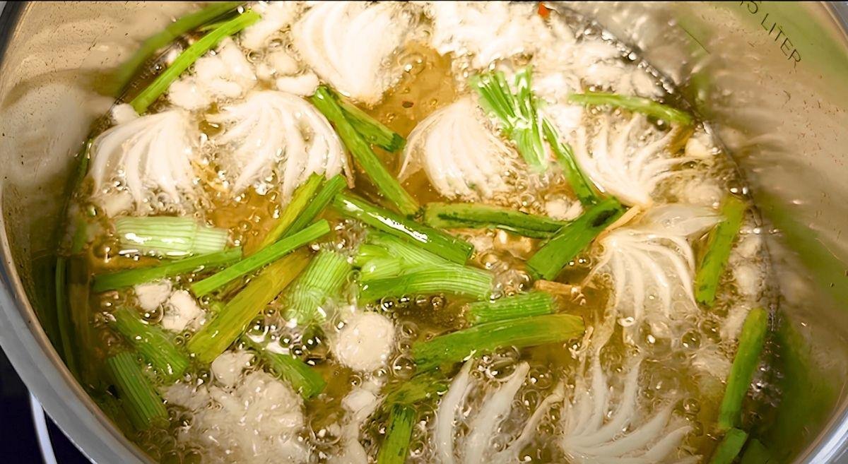 spring onion and garlic cooking in oil