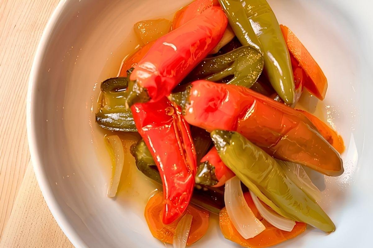 Bowl of pickled escabeche chillies with carrot and onion