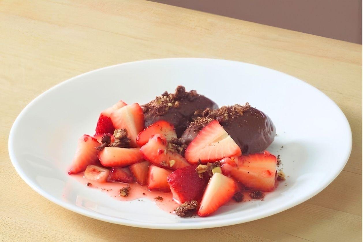 finished plate of dark chocolate mousse and strawberries