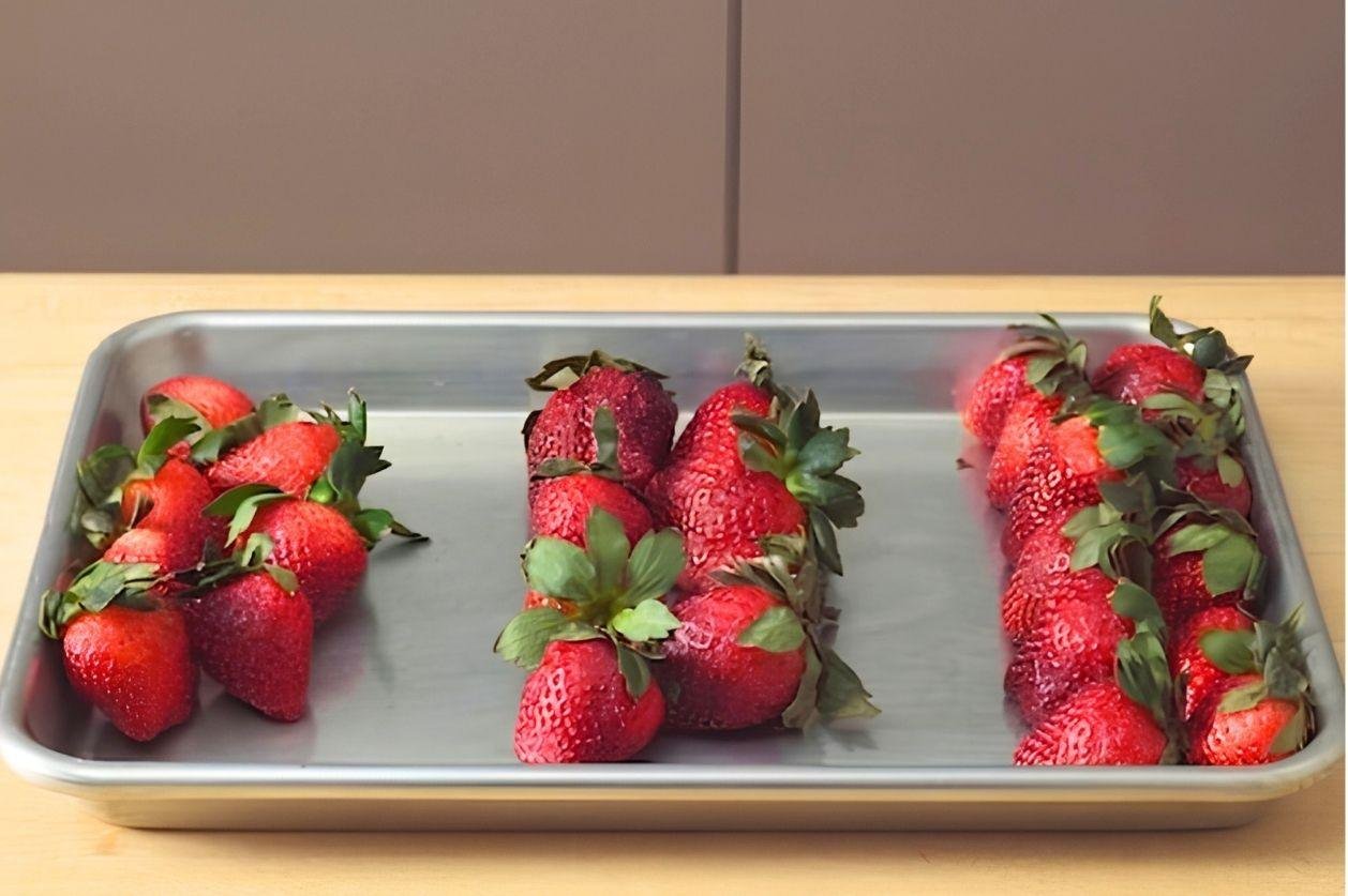 Tray of fresh strawberries arranged in rows