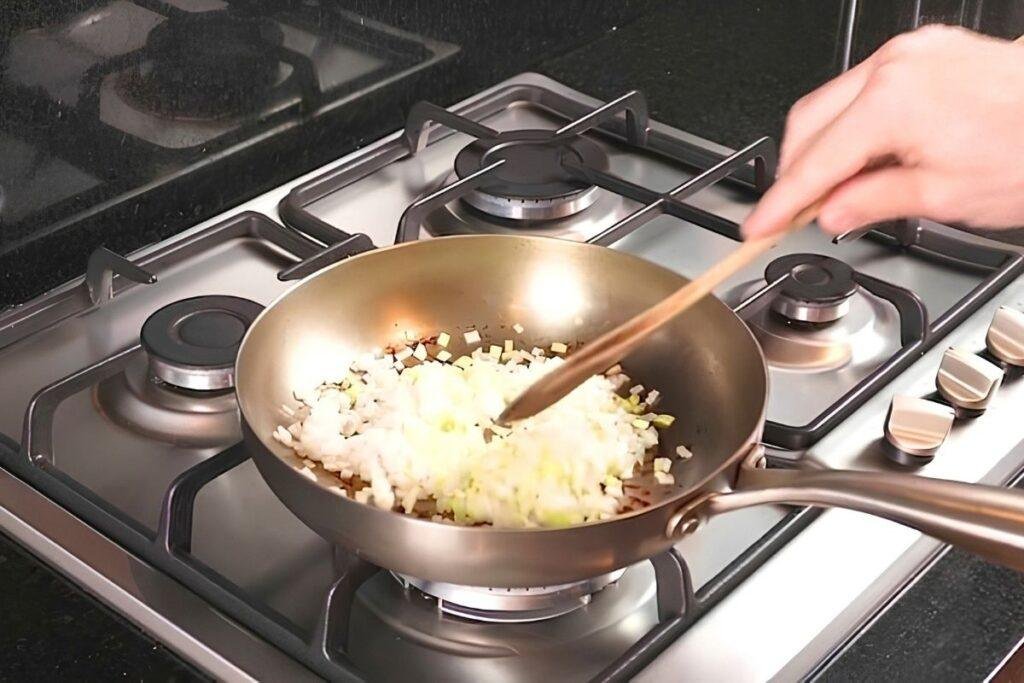 leek frying in a frying pan