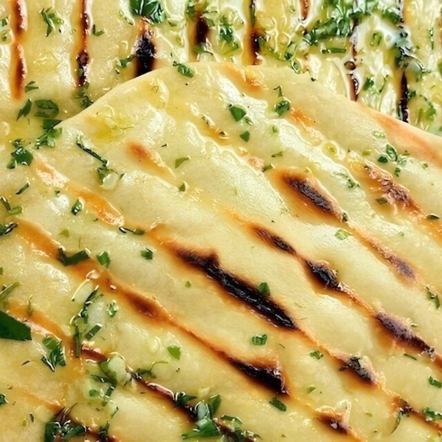 Grilled flatbread brushed with herb butter