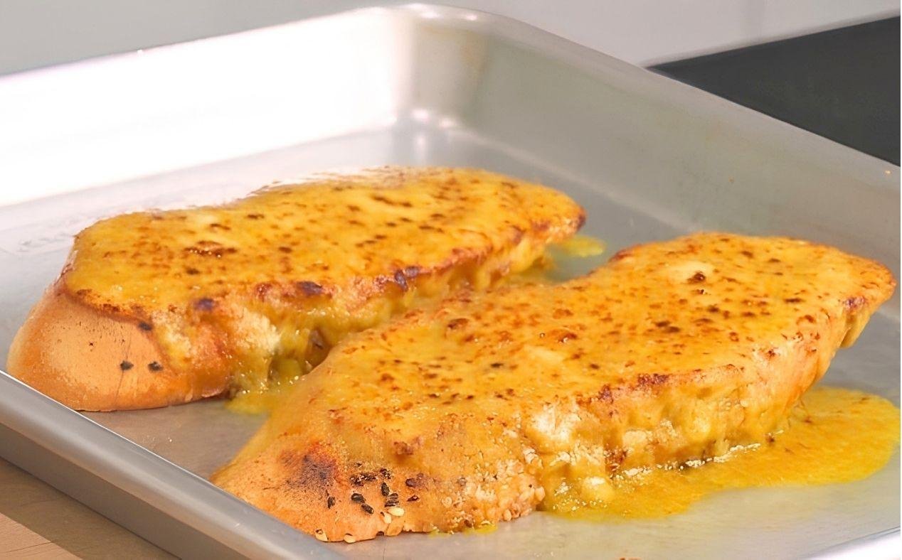 Golden rarebit on an oven tray just after being grilled