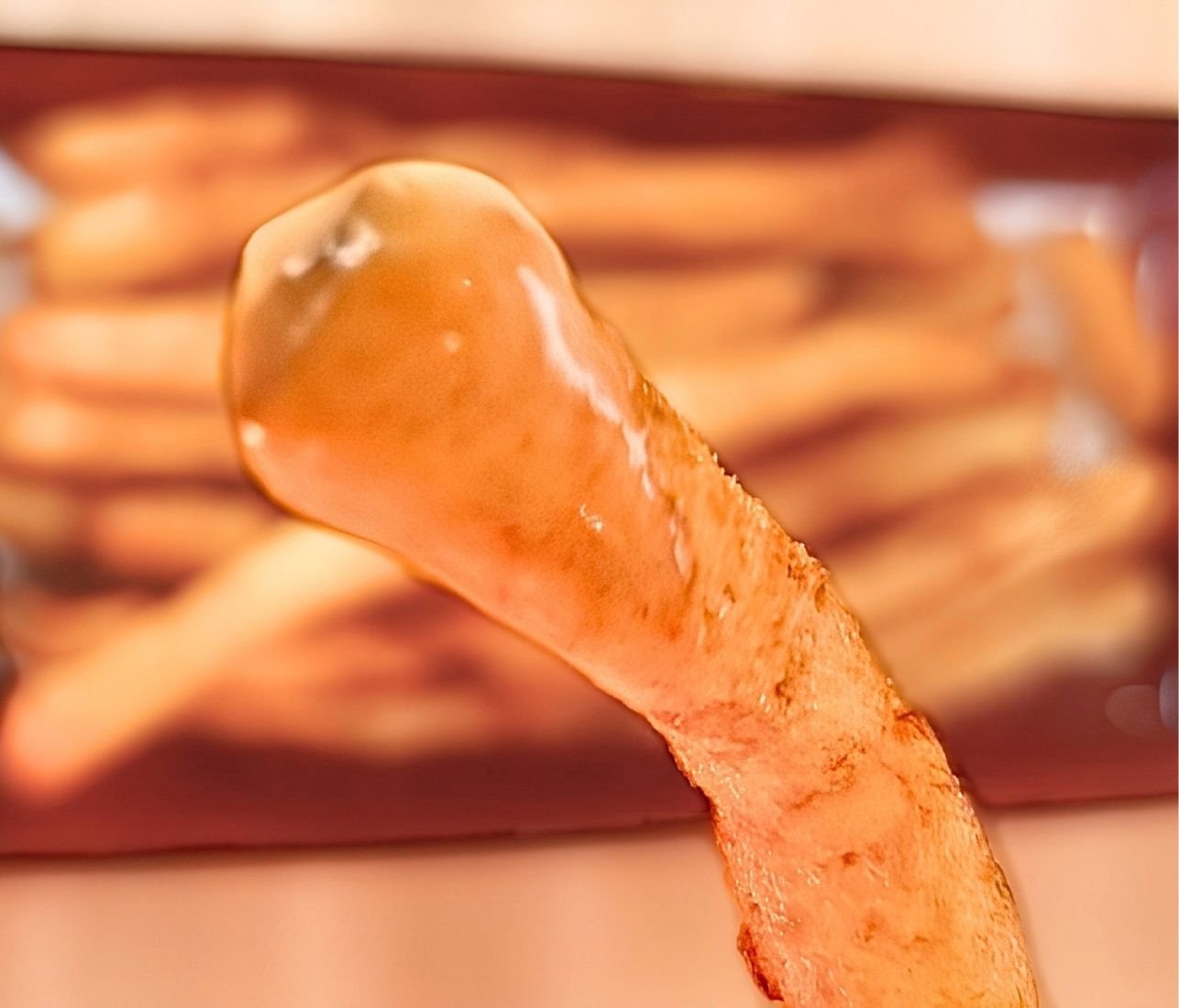 close up raspat fries dipped in sauce
