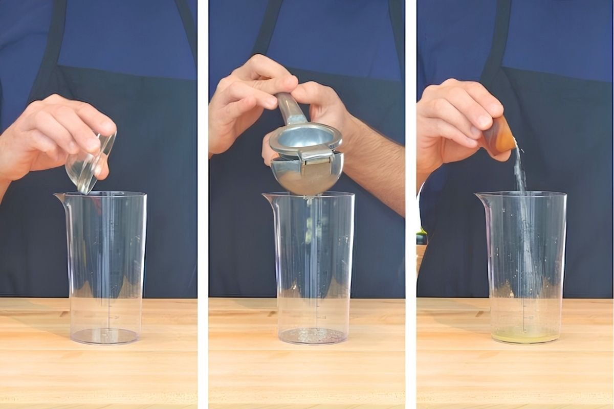 Hands adding saffron, garlic, lemon juice and salt to a measuring cup ready for blending to make aioli.