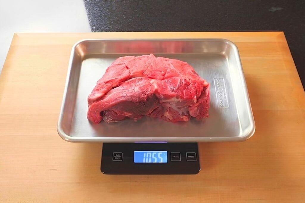 steak being weighed on scales