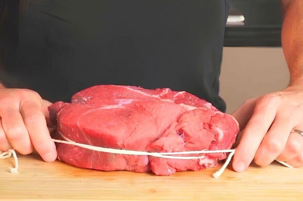 tying the chuck steak