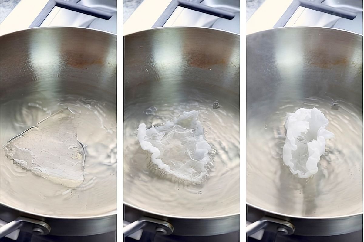 Rice paper pieces frying in a pan of oil