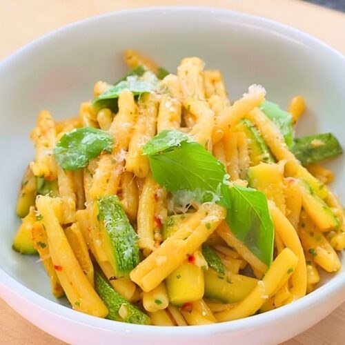 bowl of zucchini pasta with basil