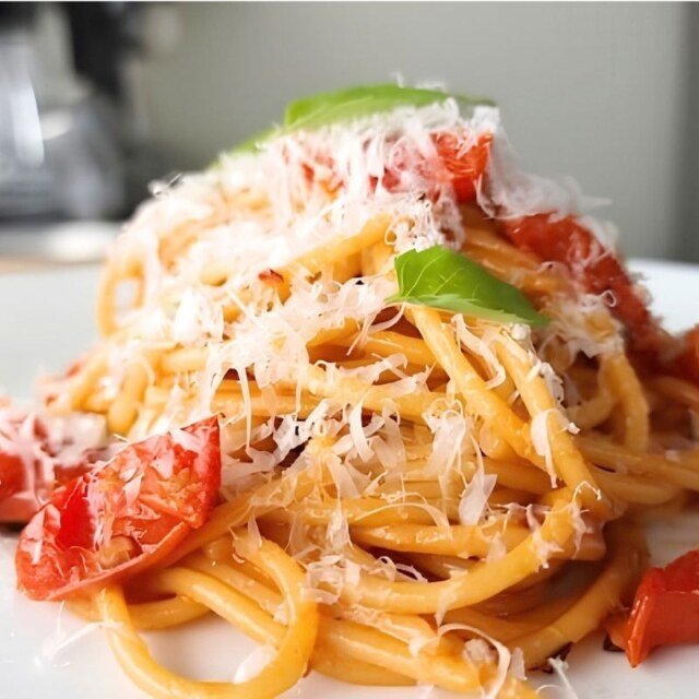 close up of the pasta sauce with basil and cheese